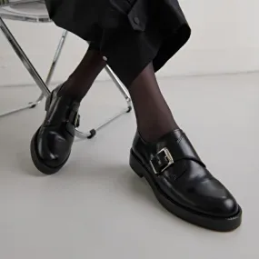 Derbies with adjustable buckles in black glazed leather