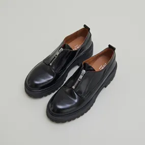 Derbies with zips and notched soles in black leather